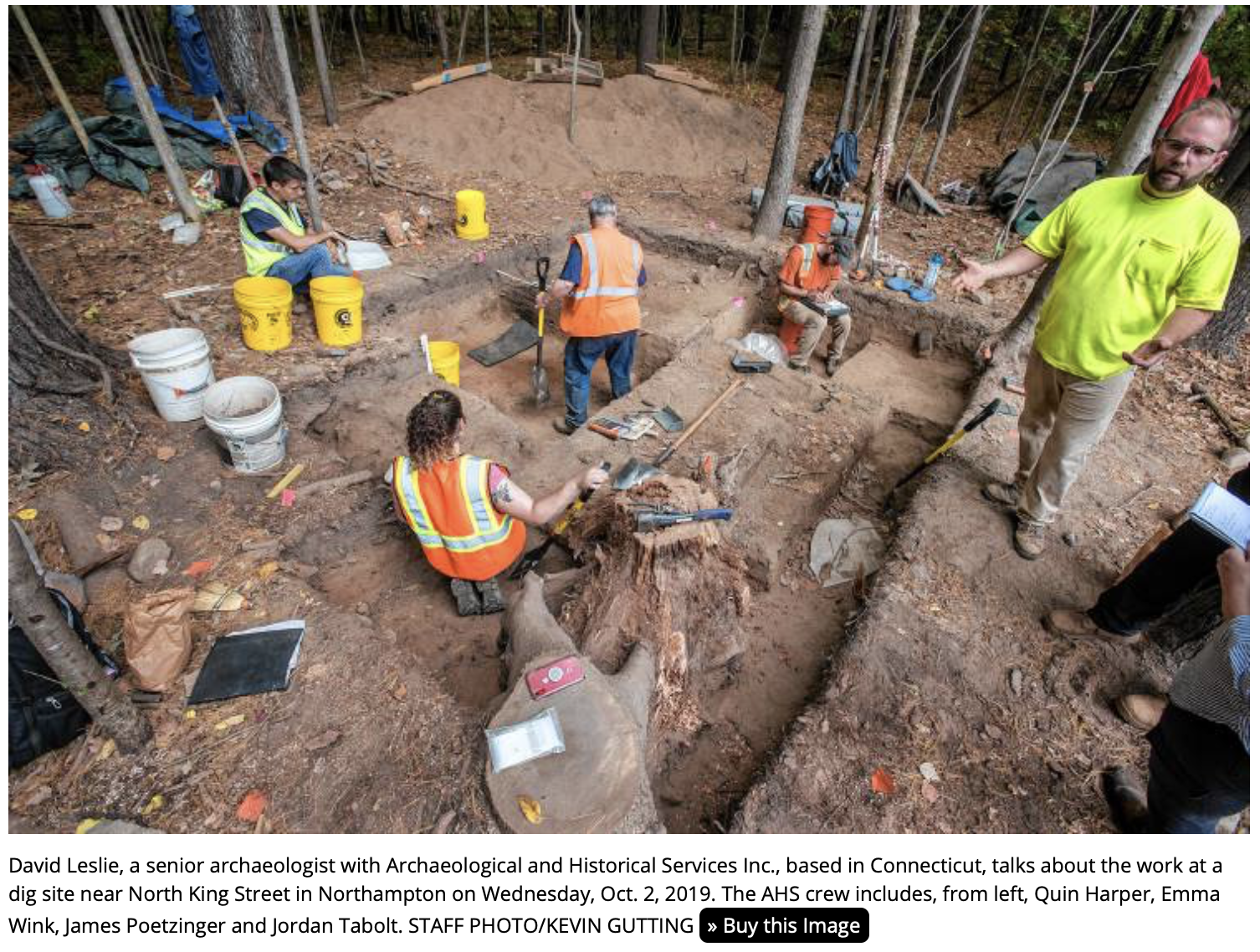 A group of people that are standing in the dirt

Description automatically generated